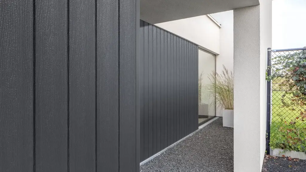 Contemporary house with dark grey cladding close-up