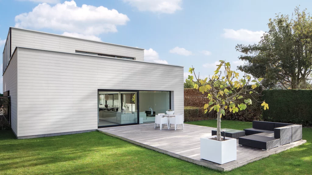 Contemporary house with white cladding and decking